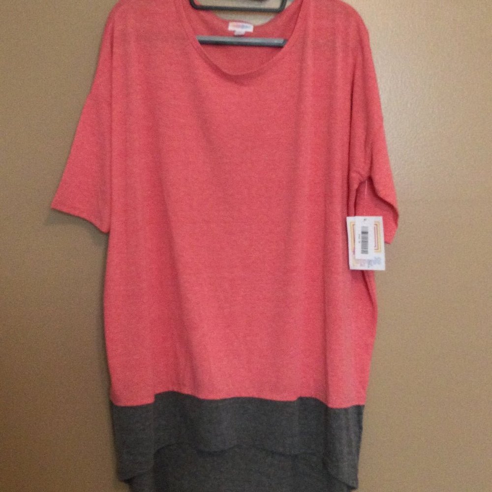New with Tags Lularoe Irma Shirt, size Medium. Solid Pink with a gray bottom
